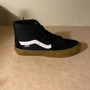 Brand new, in box with tags! Mens black high-top Vans with gum sole, size 7.5
